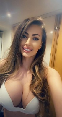 Ava escort - 34DD bust, blonde hair, brown eyes