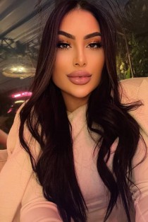 Consuela escort - 34DD bust, brunette hair, brown eyes